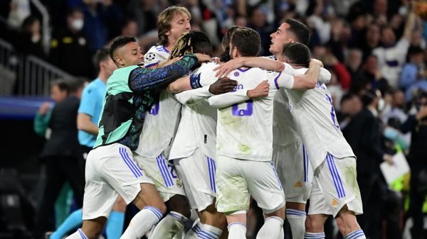 Real Madrid's players celebrate after winning the UEFA Champions League semi-final second leg football match between Real Madrid CF and Manchester City at the Santiago Bernabeu stadium in Madrid on May 4, 2022. Real Madrid's players celebrate after winning the UEFA Champions League semi-final second leg football match between Real Madrid CF and Manchester City at the Santiago Bernabeu stadium in Madrid on May 4, 2022. - Sputnik International