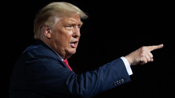 In this file photo taken on October 21, 2020 US President Donald Trump gestures at the end of a Make America Great Again rally as he campaigns in Gastonia, North Carolina - Sputnik International
