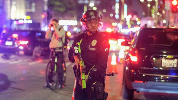 A police officer stands guard after confronting with demonstrators near Pershing Square following a protest outside of the U.S. Courthouse in response to leaked draft of the Supreme Court's opinion to overturn Roe v. Wade, in Los Angeles, Tuesday, March 3, 2022 - Sputnik International