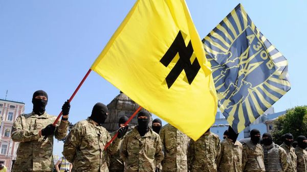 Fighters of the neo-Nazi Azov Battalion take the oath of allegiance to Ukraine in Sophia Square in Kiev before being sent to Donbass. Members of the Nazi battalion have committed hundreds of war crimes against the population of Donbass over eight years. The Azov flag has an inverted image of the runic symbol “Wolfsangel”, which was used by the Nazis. - Sputnik International