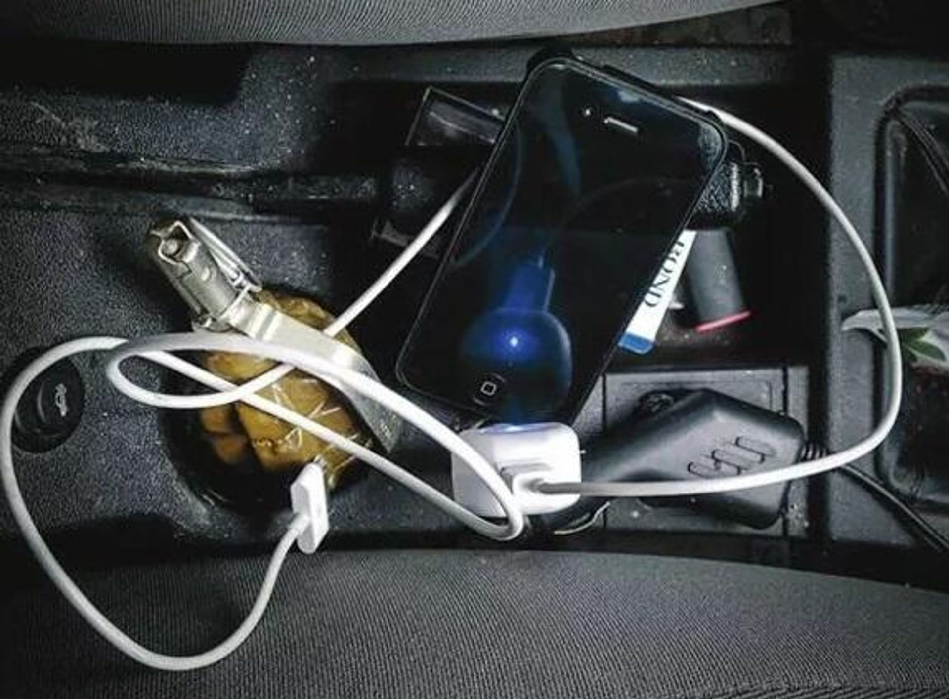 Hand grenade next to iPhone - Sputnik International, 1920, 09.05.2022