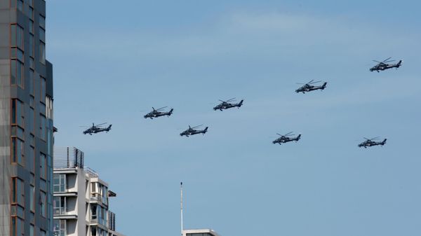 Z-10 attack helicopters fly in formation during a parade commemorating the 70th anniversary of Japan's surrender during World War II in Beijing, Thursday, Sept. 3, 2015. - Sputnik International