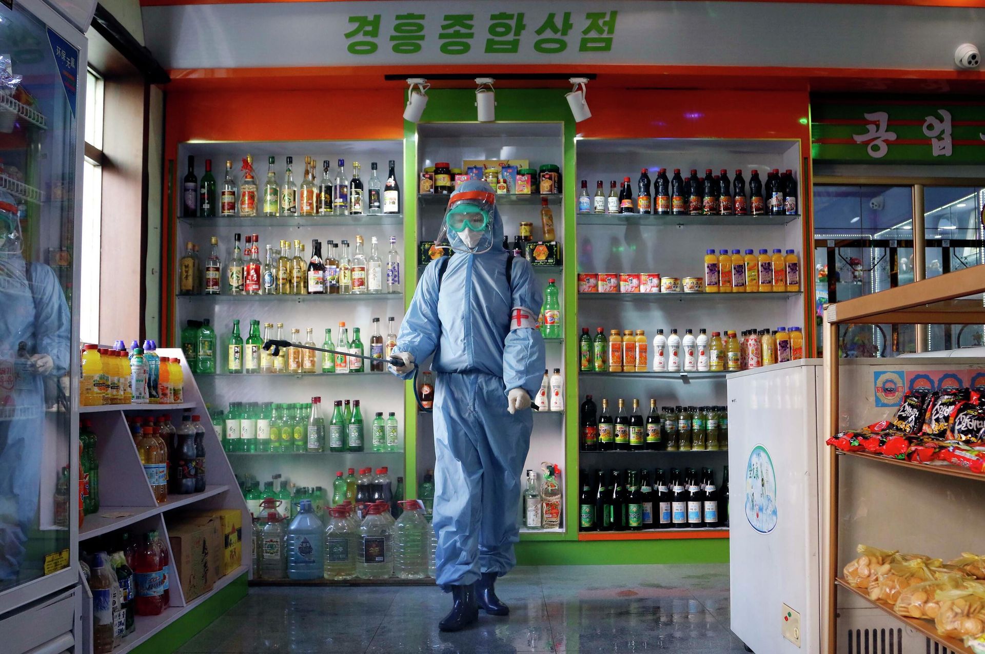 FILE - An employee of the Kyonghung Foodstuff General Store disinfects the showroom in Pyongyang, North Korea, Wednesday, Nov. 10, 2021. Before acknowledging domestic COVID-19 cases, Thursday, May 12, 2022, North Korea spent 2 1/2 years rejecting outside offers of vaccines and steadfastly claiming that its superior socialist system was protecting its 26 million people from “a malicious virus” that had killed millions around the world. FILE - An employee of the Kyonghung Foodstuff General Store disinfects the showroom in Pyongyang, North Korea, Wednesday, Nov. 10, 2021. Before acknowledging domestic COVID-19 cases, Thursday, May 12, 2022, North Korea spent 2 1/2 years rejecting outside offers of vaccines and steadfastly claiming that its superior socialist system was protecting its 26 million people from “a malicious virus” that had killed millions around the world. - Sputnik International, 1920, 15.05.2022