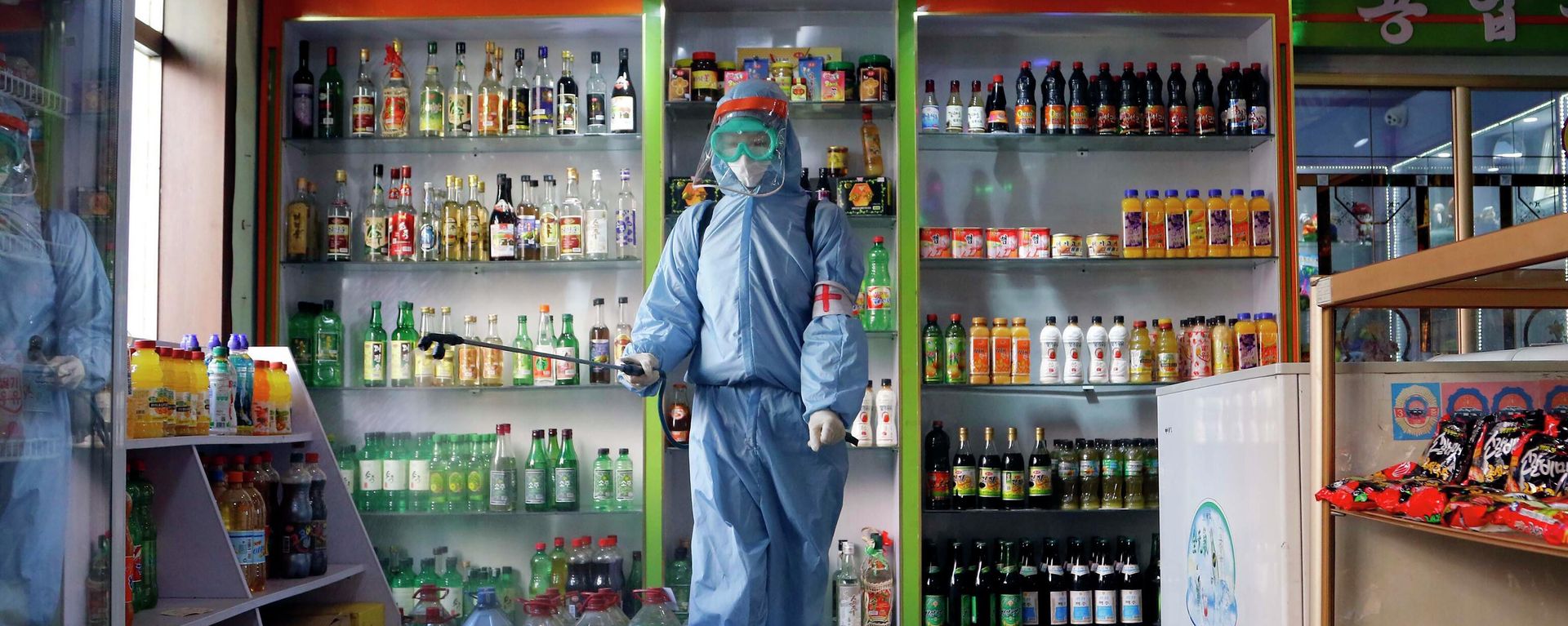 FILE - An employee of the Kyonghung Foodstuff General Store disinfects the showroom in Pyongyang, North Korea, Wednesday, Nov. 10, 2021. Before acknowledging domestic COVID-19 cases, Thursday, May 12, 2022, North Korea spent 2 1/2 years rejecting outside offers of vaccines and steadfastly claiming that its superior socialist system was protecting its 26 million people from “a malicious virus” that had killed millions around the world. FILE - An employee of the Kyonghung Foodstuff General Store disinfects the showroom in Pyongyang, North Korea, Wednesday, Nov. 10, 2021. Before acknowledging domestic COVID-19 cases, Thursday, May 12, 2022, North Korea spent 2 1/2 years rejecting outside offers of vaccines and steadfastly claiming that its superior socialist system was protecting its 26 million people from “a malicious virus” that had killed millions around the world. - Sputnik International, 1920, 11.08.2022