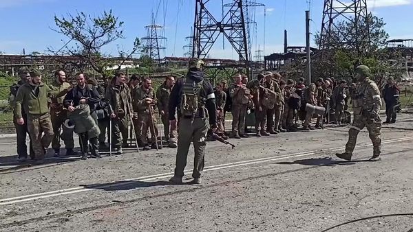 In this handout video grab released by the Russian Defence Ministry, service members of Ukrainian forces who have surrendered at the Azovstal steel plant stand in line in the Russia-controlled port city of Mariupol, Donetsk People's Republi - Sputnik International