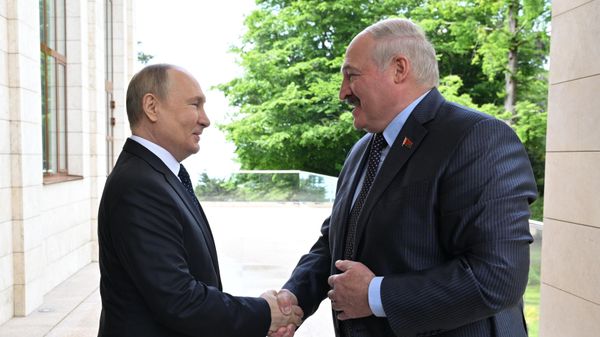 May 23, 2022. Russian President Vladimir Putin and Belarusian President Alexander Lukashenko (right) during a meeting. - Sputnik International