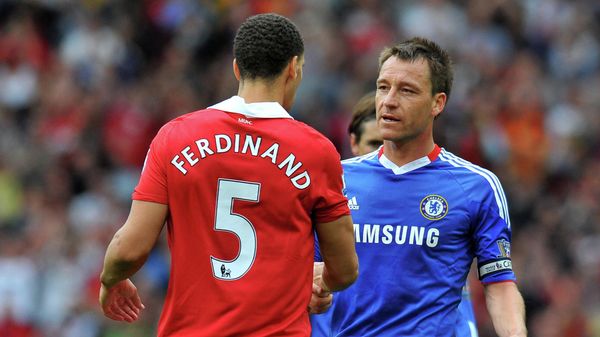 Chelsea's English defender John Terry (R) shakes hands with Manchester United's English defender Rio Ferdinand after losing 2-1 in the English Premier League football match between Manchester United and Chelsea at Old Trafford in Manchester, north west England, on May 8, 2011 Chelsea's English defender John Terry (R) shakes hands with Manchester United's English defender Rio Ferdinand after losing 2-1 in the English Premier League football match between Manchester United and Chelsea at Old Trafford in Manchester, north west England, on May 8, 2011 - Sputnik International