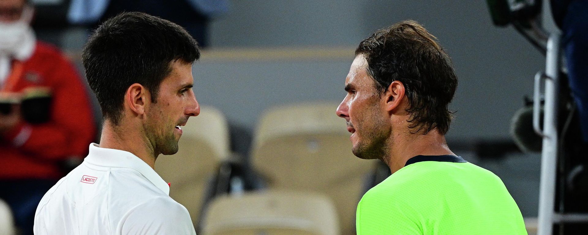 Serbia's Novak Djokovic (L) and Spain's Rafael Nadal shake hands at the end of their men's singles semi-final tennis match on Day 13 of The Roland Garros 2021 French Open tennis tournament in Paris on June 11, 2021 - Sputnik International, 1920, 31.05.2022