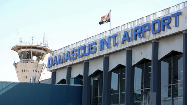 A picture shows the Syrian flag swaying in the wind at the Damascus International airport in the Syrian capital on October 1, 2020. - Sputnik International