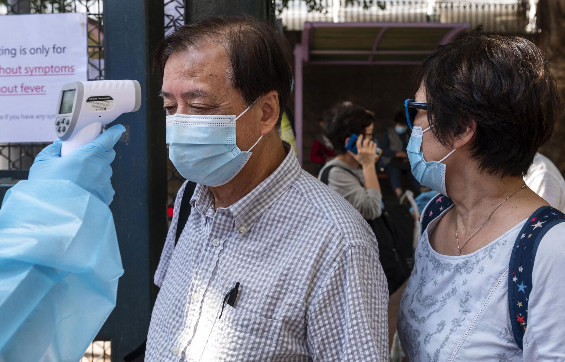 A health worker checks the temperatures of visitor at the entrance of a Community Testing Centre in Hong Kong, China. After days of rapidly increase of positive COVID-19 cases, the Hong Kong government set up testing facility centers where people can be tested for COVID-19 and obtain the result within 24 hours. A health worker checks the temperatures of visitor at the entrance of a Community Testing Centre in Hong Kong, China. After days of rapidly increase of positive COVID-19 cases, the Hong Kong government set up testing facility centers where people can be tested for COVID-19 and obtain the result within 24 hours. - Sputnik International, 1920, 24.10.2022