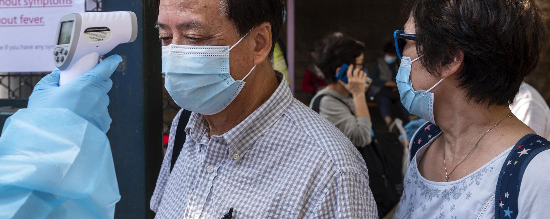 A health worker checks the temperatures of visitor at the entrance of a Community Testing Centre in Hong Kong, China. After days of rapidly increase of positive COVID-19 cases, the Hong Kong government set up testing facility centers where people can be tested for COVID-19 and obtain the result within 24 hours. A health worker checks the temperatures of visitor at the entrance of a Community Testing Centre in Hong Kong, China. After days of rapidly increase of positive COVID-19 cases, the Hong Kong government set up testing facility centers where people can be tested for COVID-19 and obtain the result within 24 hours. - Sputnik International, 1920, 27.11.2022