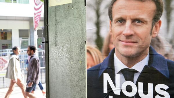 People are pictured on the street during the second round of the 2022 French presidential election at a polling station, in Paris, France. - Sputnik International