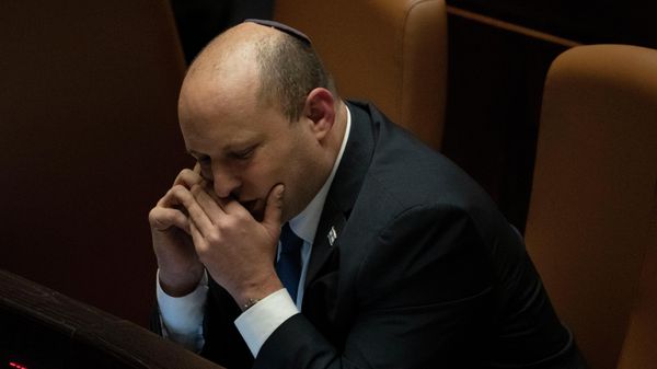 Israeli Prime Minister Naftali Bennett makes a call before voting on a law on the legal status of Jewish settlers in the occupied West Bank, during a session of the Knesset, Israel's parliament, in Jerusalem, Monday, June 6, 2022.  - Sputnik International