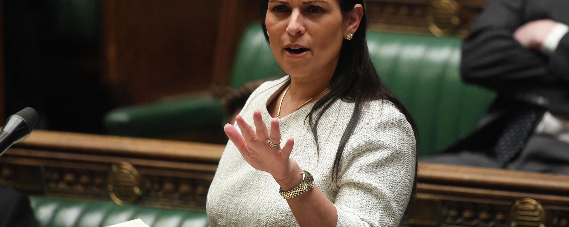 A handout photograph released by the UK Parliament shows Britain's Home Secretary Priti Patel gesturing as she gives a statement concerning the deal plan to send migrants and asylum seekers who cross the Channel to Rwanda, at the House of Commons, in London, on April 19, 2022 A handout photograph released by the UK Parliament shows Britain's Home Secretary Priti Patel gesturing as she gives a statement concerning the deal plan to send migrants and asylum seekers who cross the Channel to Rwanda, at the House of Commons, in London, on April 19, 2022 - Sputnik International, 1920, 05.07.2022