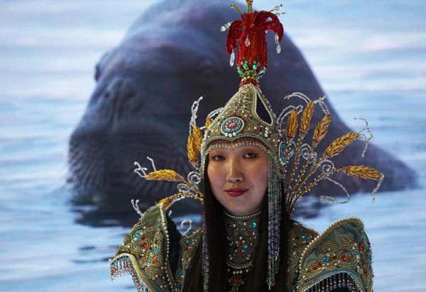 A girl wearing a national costume stands at the stall of 2021-2023 Arctic Council at the St. Petersburg International Economic Forum (SPIEF) in Russia. - Sputnik International