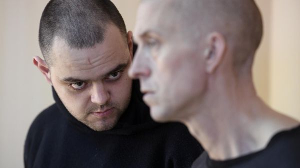 British citizens Aiden Aslin and Shaun Pinner, surrounded by Russian forces after they went to fight in Ukraine and accused of being a foreign mercenaries, sit inside a defendants' cage as they attend a court hearing in Donetsk, Donetsk People's Republic - Sputnik International