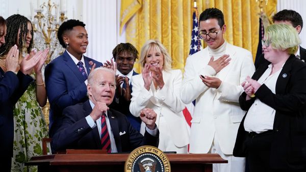 President Joe Biden celebrates after signing an executive order at an event to celebrate Pride Month in the East Room of the White House, Wednesday, June 15, 2022, in Washington. (AP Photo/Patrick Semansky) - Sputnik International