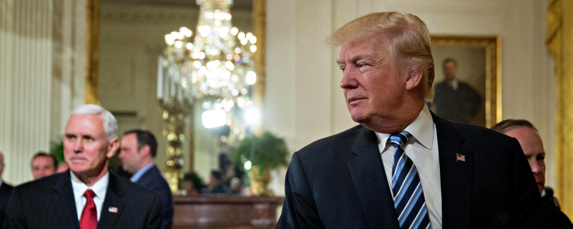 WASHINGTON, DC - JANUARY 22: U.S. President Donald Trump walks out with U.S. Vice President Mike Pence during a swearing in ceremony of White House senior staff in the East Room of the White House on January 22, 2017 in Washington, DC. - Sputnik International, 1920, 17.06.2022