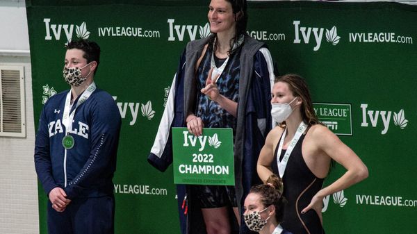In this file photo taken on February 19, 2022 transgender swimmer Lia Thomas (2nd L) of Penn University and transgender swimmer Iszac Henig (L) of Yale pose with their medals after placing first and second in the 100-yard freestyle swimming race at the 2022 Ivy League Women's Swimming & Diving Championships at Harvard University in Cambridge, Massachusetts. - Sputnik International