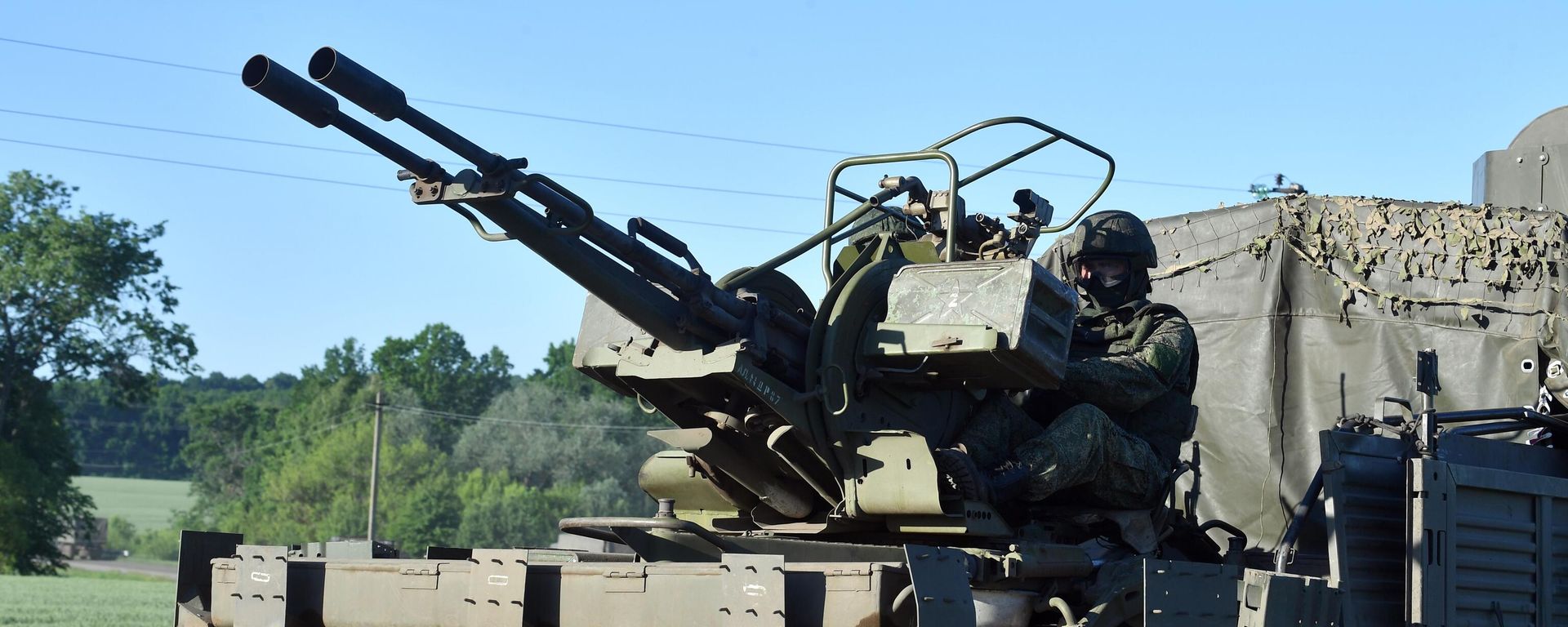 Military hardware accompanies the logistics column of the Russian Armed Forces in the course of Russia's military operation in Ukraine, at an unknown location - Sputnik International, 1920, 16.07.2022