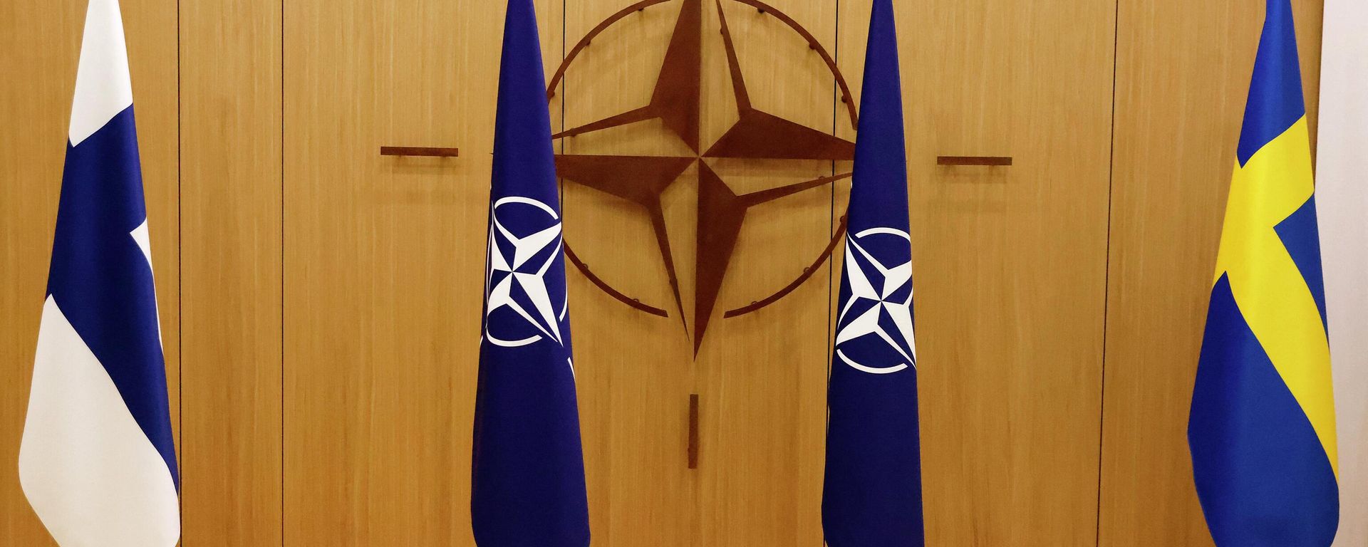 A photograph shows flags of Finland, NATO and Sweden during a ceremony during a ceremony to mark Sweden's and Finland's application for membership in Brussels, on May 18, 2022 - Sputnik International, 1920, 29.06.2022