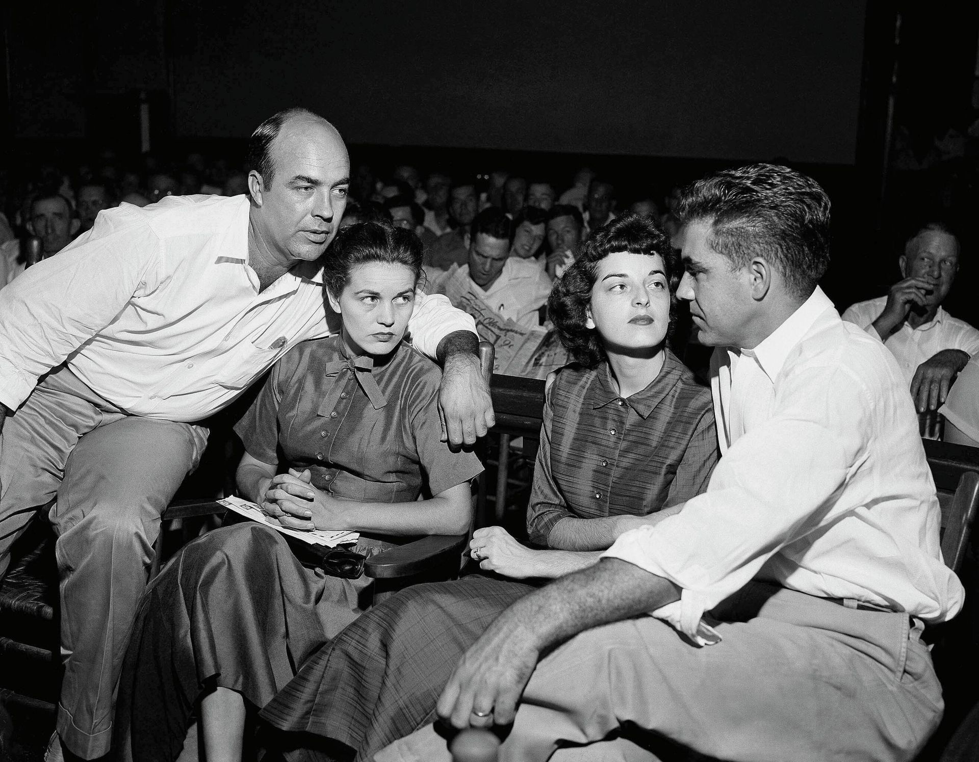 FILE - In this Sept. 23, 1955, file photo, J.W. Milam, left, his wife, second from left, Roy Bryant, far right, and his wife, Carolyn Bryant, sit together in a courtroom in Sumner, Miss. Bryant and his half-brother Milam were charged with murder but acquitted in the kidnapping and torture slaying of 14-year-old black teen Emmett Till in 1955 after he allegedly whistled at Carolyn Bryant. A team searching the basement of a Mississippi courthouse for evidence about the lynching of Black teenager Emmett Till has found the unserved warrant in June 2022 charging a white woman in his kidnapping in 1955, and relatives of the victim want authorities to finally arrest her nearly 70 years later.  - Sputnik International, 1920, 09.08.2022