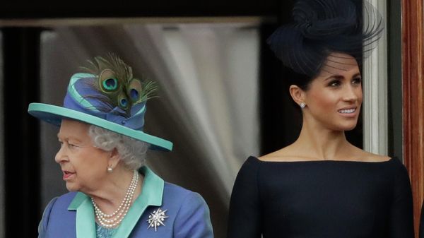 FILE - In this Tuesday, July 10, 2018 file photo Britain's Queen Elizabeth II and Meghan the Duchess of Sussex stand on a balcony to watch a flypast of Royal Air Force aircraft pass over Buckingham Palace in London. As part of a surprise announcement distancing themselves from the British royal family, Prince Harry and his wife Meghan declared they will work to become financially independent _ a move that has not been clearly spelled out and could be fraught with obstacles - Sputnik International