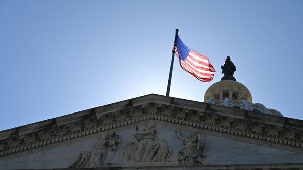 An American flag is seen on top of the US Capitol in Washington, DC, on June 4, 2022 - Sputnik International