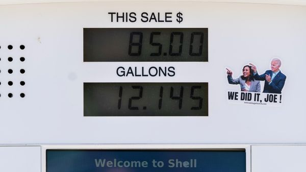 A political sticker mocking President Joe Biden and Vice President Kamala Harris is seen next to a gas pump display showing a transaction in Los Angeles, Monday, March 7, 2022. The price of regular gasoline broke $4 per gallon on average across the U.S. on Sunday for the first time since 2008. (AP Photo/Jae C. Hong) - Sputnik International