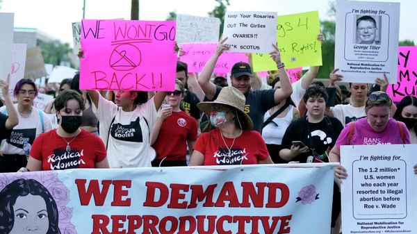 Thousands of protesters march around the Arizona Capitol after the Supreme Court decision to overturn the landmark Roe v. Wade abortion decision Friday, June 24, 2022, in Phoenix.  - Sputnik International