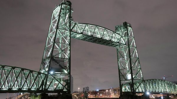 View of the Koningshaven Bridge, known as De Hef, (The Lift), in Rotterdam, Netherlands, Thursday, Feb. 3, 2022. A plan to dismantle the historic bridge in the heart of Dutch port city so that a huge yacht, reportedly being built for Amazon founder Jeff Bezos, can get to the North Sea is unlikely to be plain sailing. Reports this week that the city had already agreed to take apart the recently restored bridge sparked anger in the city, with one Facebook group set up calling for people to pelt the multimillion dollar yacht with rotten eggs. - Sputnik International