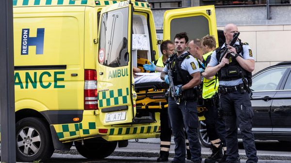 Police stand guard near an ambulance in front of the Fields shopping mall, where a gunman killed three people and wounded several others in Copenhagen - Sputnik International