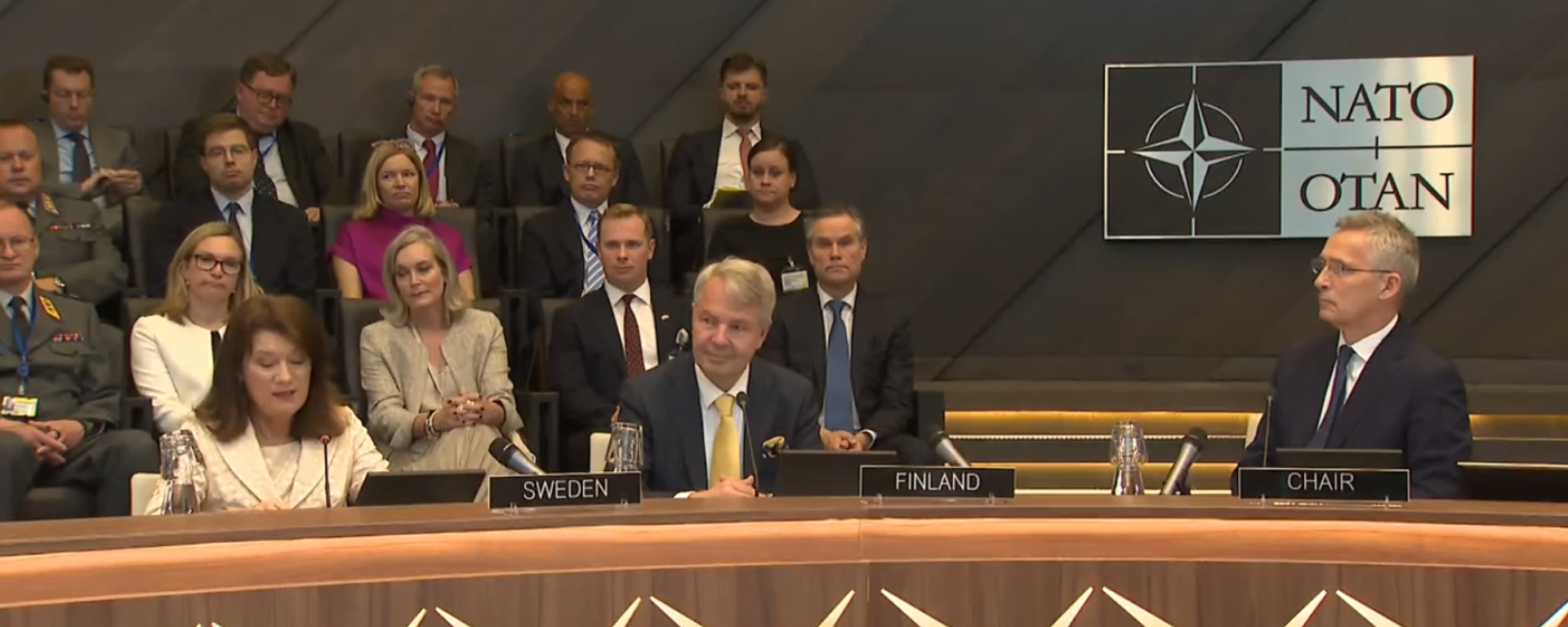 NATO Secretary General Jens Stoltenberg, the foreign ministers of Sweden and Finland, and ambassadors from NATO countries at signing ceremony on the signature of the accession protocols for the two Nordic nations. July 5, 2022. - Sputnik International, 1920, 05.07.2022