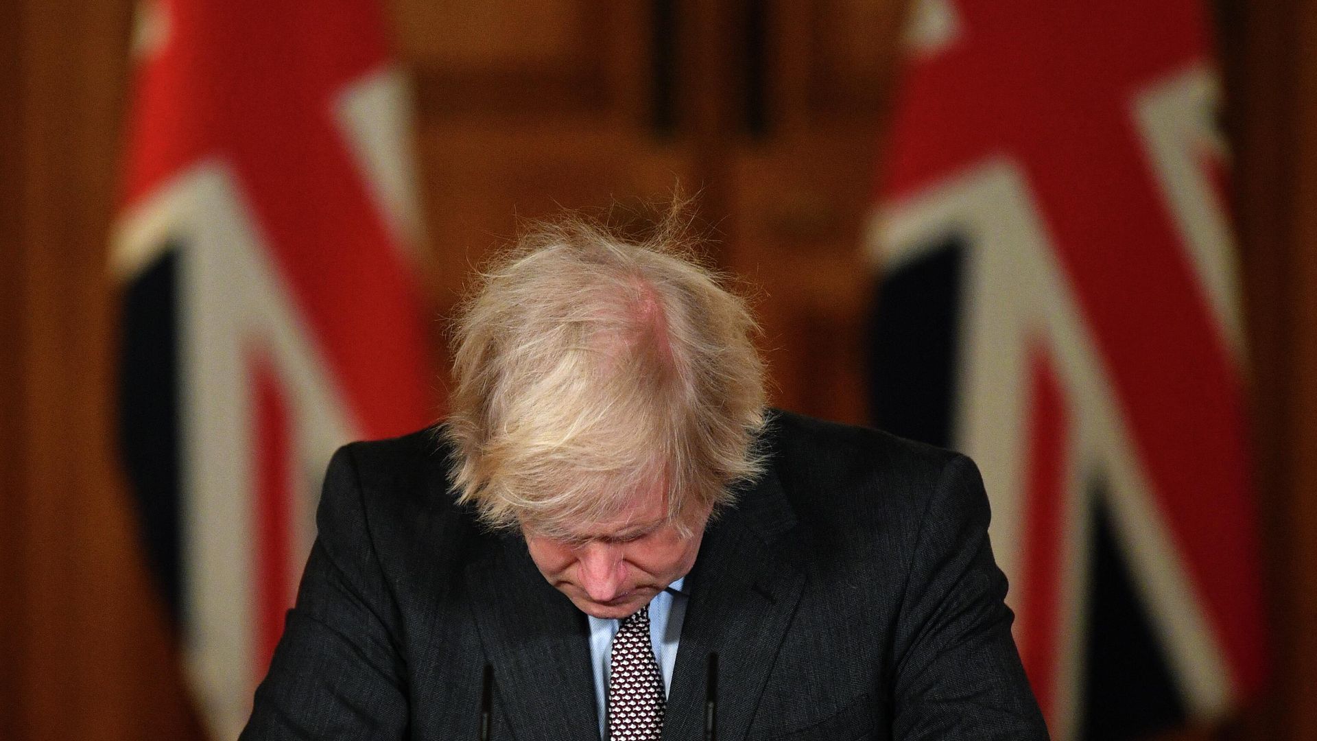 (FILES) In this file photo taken on January 26, 2021 Britain's Prime Minister Boris Johnson looks down at the podium as he attends a virtual press conference inside 10 Downing Street in central London. - Boris Johnson will resign as Conservative party leader on July 7, 2022 - Sputnik International, 1920, 07.07.2022