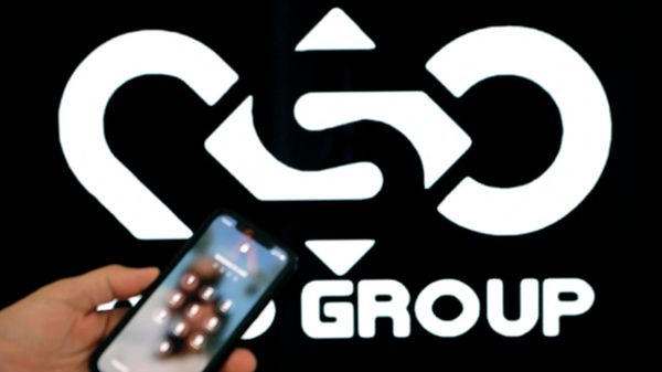 A photographic illustration shows a mobile phone near the NSO Group company logo on February 9, 2022 in the Israeli city of Netanya. - Sputnik International