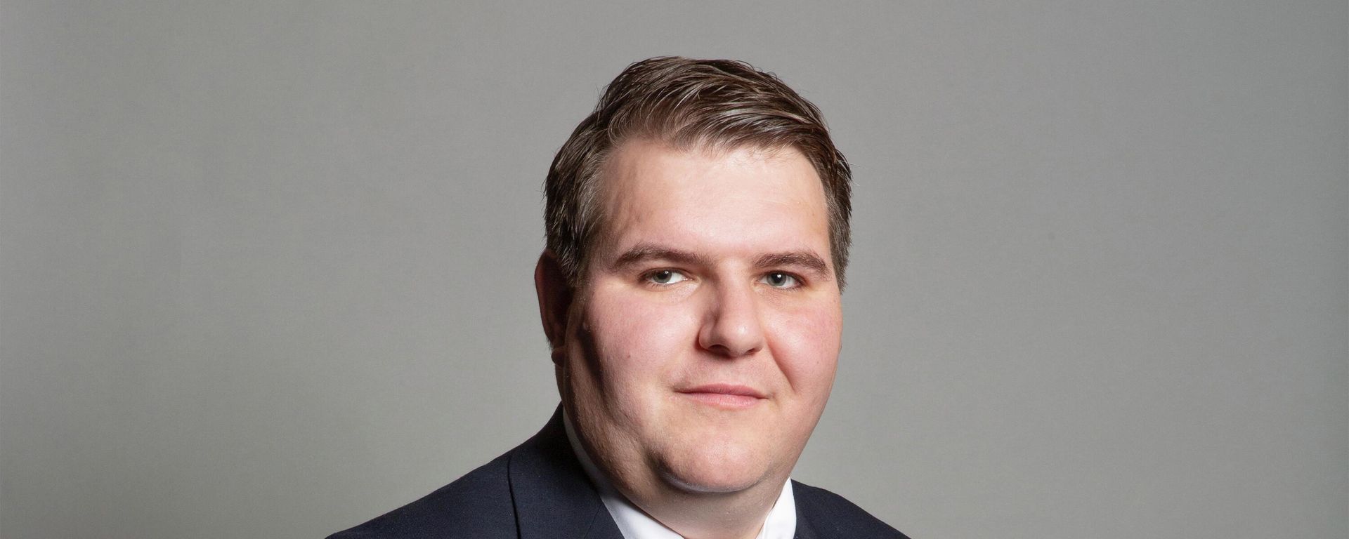 Official portrait of Dr Jamie Wallis, the UK's first openly transgender MP - Sputnik International, 1920, 11.07.2022