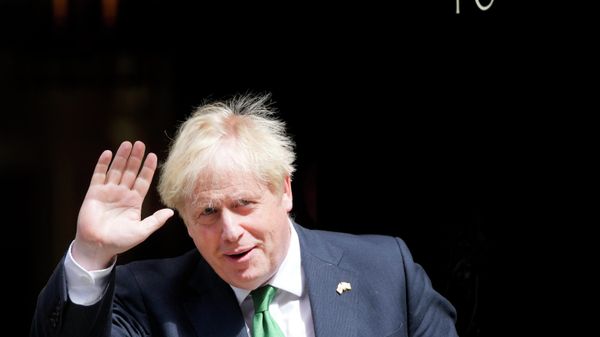 Britain's Prime Minister Boris Johnson leaves 10 Downing Street to attend the weekly Prime Ministers' Questions - Sputnik International