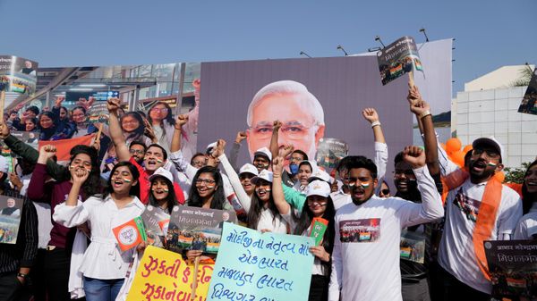 Students cheer during a road show by Indian Prime Minister Narendra Modi in Ahmedabad, India, Friday, March 11, 2022. - Sputnik International