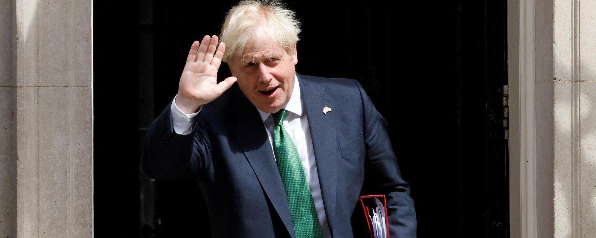 Britain's Prime Minister Boris Johnson walks to a waiting car as he leaves from 10 Downing Street in central London on July 13, 2022 to head to the Houses of Parliament for the weekly Prime Minister's Questions (PMQs) session Britain's Prime Minister Boris Johnson walks to a waiting car as he leaves from 10 Downing Street in central London on July 13, 2022 to head to the Houses of Parliament for the weekly Prime Minister's Questions (PMQs) session - Sputnik International, 1920, 12.08.2022