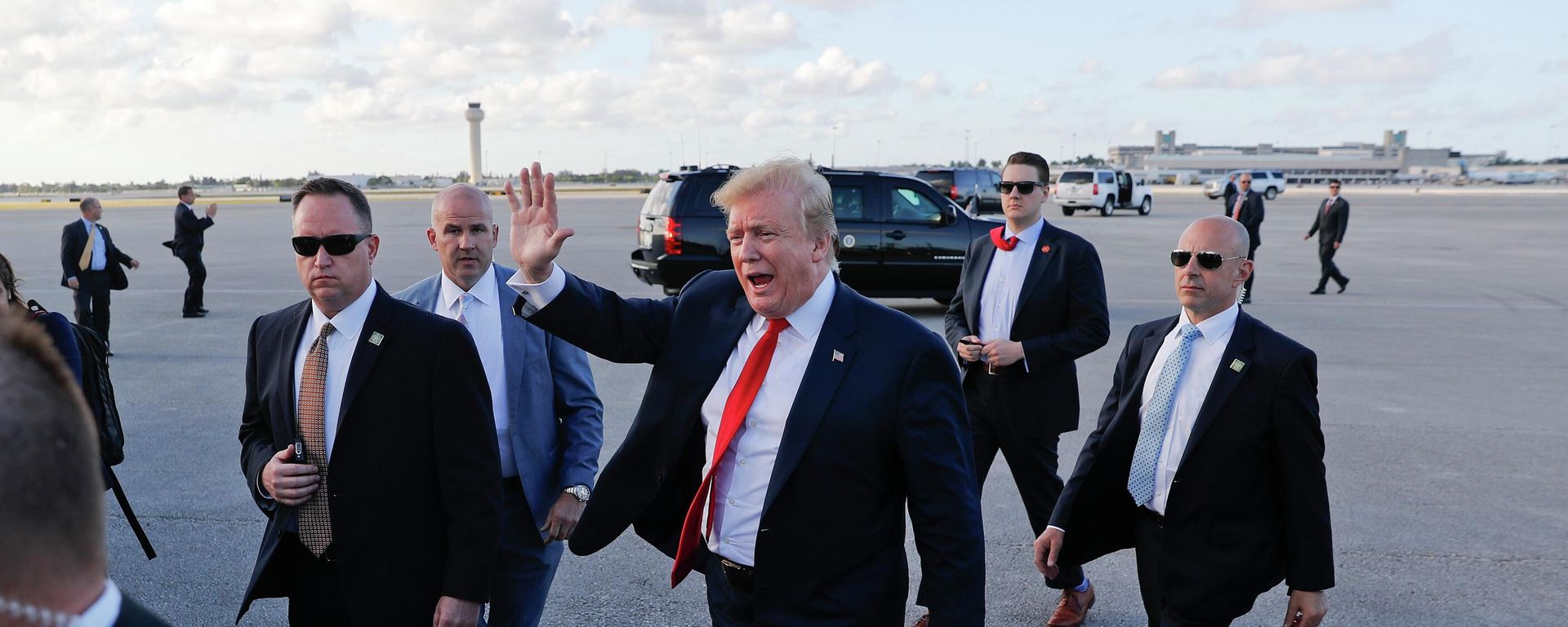 In this April 18, 2019, file photo, President Donald Trump, center, surrounded by members of the Secret Service, walks across the tarmac to begin to greet supporters during his arrival at Palm Beach International Airport, in West Palm Beach, Fla. As the Russia investigation threatened to shadow Donald Trump’s presidency, he became increasingly concerned he would be seen as a cheater and a fraud. In this April 18, 2019, file photo, President Donald Trump, center, surrounded by members of the Secret Service, walks across the tarmac to begin to greet supporters during his arrival at Palm Beach International Airport, in West Palm Beach, Fla. As the Russia investigation threatened to shadow Donald Trump’s presidency, he became increasingly concerned he would be seen as a cheater and a fraud. - Sputnik International, 1920, 21.07.2022