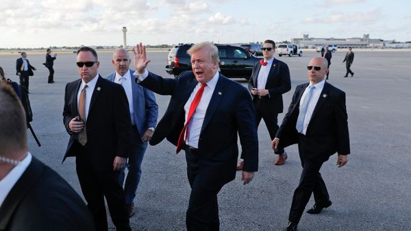 In this April 18, 2019, file photo, President Donald Trump, center, surrounded by members of the Secret Service, walks across the tarmac to begin to greet supporters during his arrival at Palm Beach International Airport, in West Palm Beach, Fla. As the Russia investigation threatened to shadow Donald Trump’s presidency, he became increasingly concerned he would be seen as a cheater and a fraud.  - Sputnik International