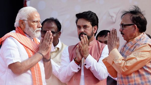 Indian Minister for Heavy Industries Mahendra Nath Pandey, right, and Information and Broadcasting Minister Anurag Thakur greet Indian Prime Minister Narendra Modi during the oath-taking ceremony of Yogi Adityanath as Chief Minister of Uttar Pradesh state in Lucknow, India, Friday, March 25, 2022. - Sputnik International