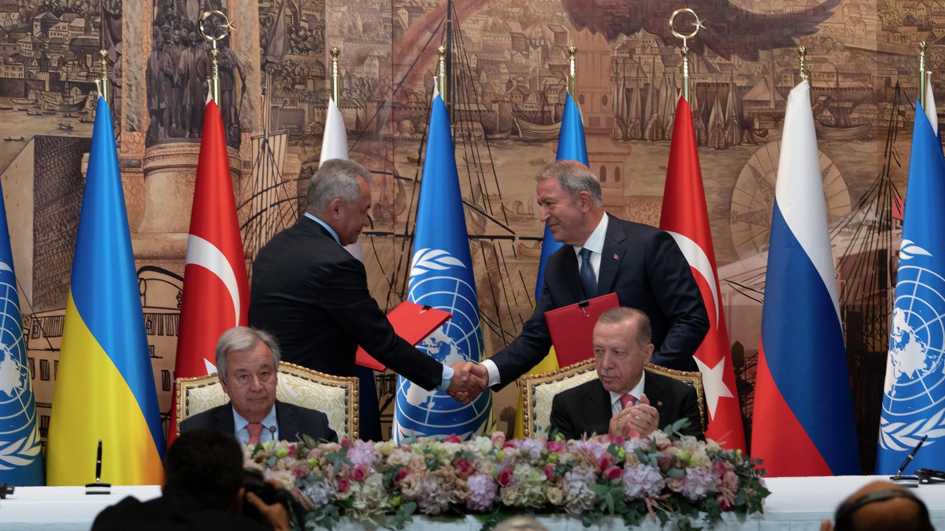 Turkish President Recep Tayyip Erdogan, right, and U.N. Secretary General, Antonio Guterres, sit as two representatives of Ukraine and Russia delegations check hands during a signing ceremony at Dolmabahce Palace in Istanbul, Turkey, Friday, July 22, 2022 Turkish President Recep Tayyip Erdogan, right, and U.N. Secretary General, Antonio Guterres, sit as two representatives of Ukraine and Russia delegations check hands during a signing ceremony at Dolmabahce Palace in Istanbul, Turkey, Friday, July 22, 2022 - Sputnik International, 1920, 23.07.2022