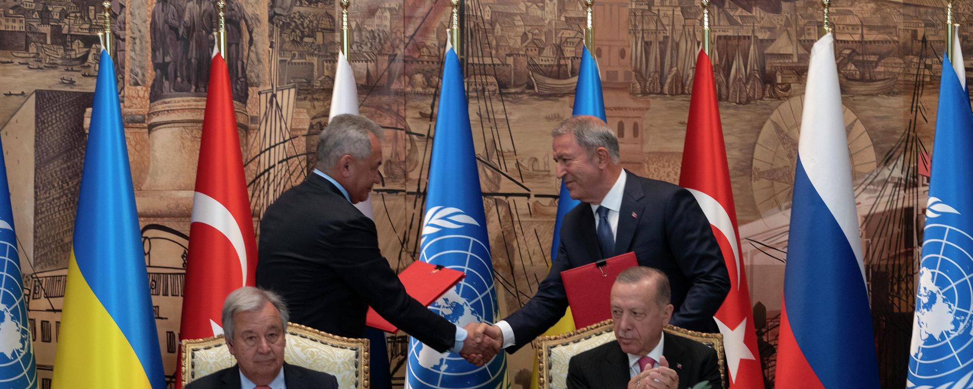 Turkish President Recep Tayyip Erdogan, right, and U.N. Secretary General, Antonio Guterres, sit as two representatives of Ukraine and Russia delegations check hands during a signing ceremony at Dolmabahce Palace in Istanbul, Turkey, Friday, July 22, 2022 Turkish President Recep Tayyip Erdogan, right, and U.N. Secretary General, Antonio Guterres, sit as two representatives of Ukraine and Russia delegations check hands during a signing ceremony at Dolmabahce Palace in Istanbul, Turkey, Friday, July 22, 2022 - Sputnik International, 1920, 23.07.2022