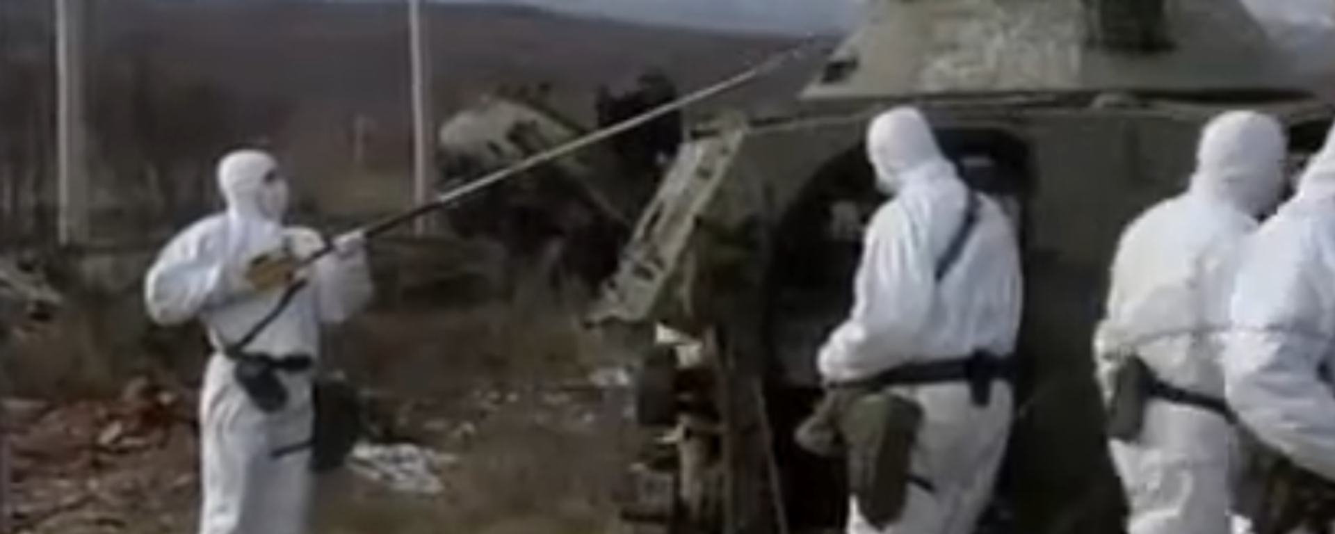 Specialists inspecting radiation levels in Kosovo in 2001, two years after the 1999 NATO bombings. Screengrab from archival video. - Sputnik International, 1920, 23.07.2022