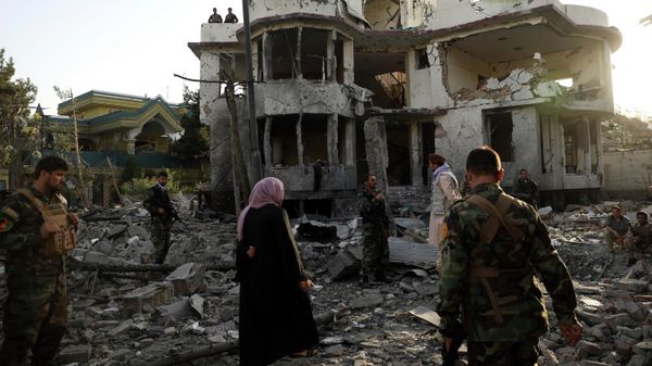 Afghan security personnel inspect a damaged building in the aftermath of an attack in Kabul, Afghanistan, on Aug. 4, 2021. - Sputnik International