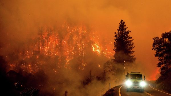 A firetruck drives along California Highway 96 as the McKinney Fire burns in Klamath National Forest, Calif., Saturday, July 30, 2022.  - Sputnik International