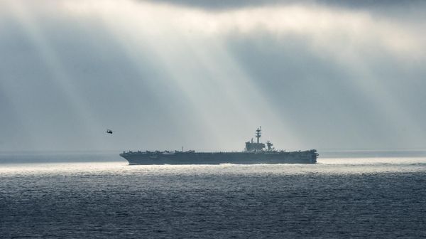 This US Navy handout photo obtained August 15, 2017 shows the aircraft carrier USS Theodore Roosevelt (CVN 71)as it transits the Pacific Ocean during a strait transit show of force exercise on August 11, 2017 in the Pacific Ocean - Sputnik International