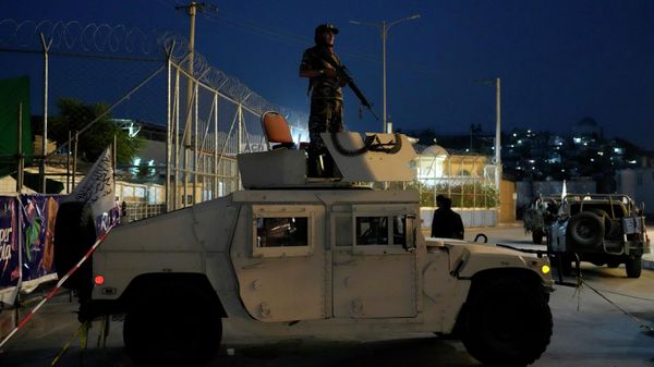 A Taliban fighter stands guard at the site of an explosion in front of the Kabul International Cricket Stadium, in Kabul, Afghanistan, Friday, July 29, 2022.  - Sputnik International