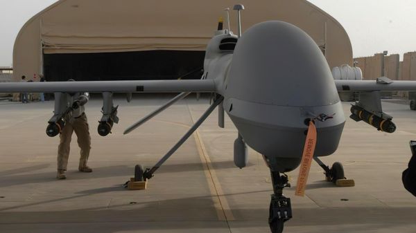 In this image provided by the U.S. Army, contactors from General Atomics load Hellfire missiles onto an MQ-1C Gray Eagle at Camp Taji, Iraq, on Feb. 27, 2011 - Sputnik International